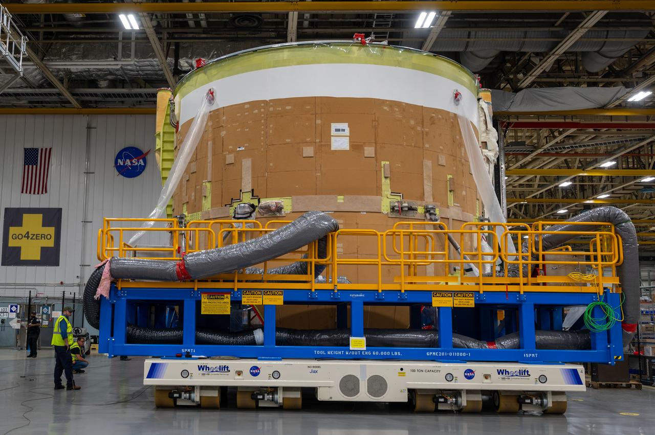 On May 24, 2022, the core stage production team moved the Space Launch System (SLS) rocket engine section for Artemis II to the core stage final integration area at NASA’s Michoud Assembly Facility in New Orleans.  While there, the engine section team is completing installation of the main propulsion systems, finishing integration of the electrical and avionics systems, and preparing for functional testing of the various systems. During final integration, the team also will install remaining internal thermal protection systems and prepare to position the engine section from vertical to horizontal so that it can be joined with the rest of the core stage. The engine section is located at the bottom of the core stage and includes the rocket’s main propulsion systems that connect to the core stage’s four RS-25 engines that will help launch the Artemis II lunar mission. This fall, the engine section will be horizontally integrated with the previously-joined forward assembly and liquid hydrogen tank to complete the core stage. NASA and core stage lead contractor Boeing are building core stages for the next three Artemis missions.  The 212-foot core stage with its RS-25 engines will provide more than 2 million pounds of thrust at launch. With Artemis, NASA will land the first woman and the first person of color on the Moon and establish long-term exploration in preparation for missions to Mars. SLS and NASA’s Orion spacecraft, along with the commercial human landing system and the Gateway in orbit around the Moon, are NASA’s backbone for deep space exploration. SLS is the only rocket that can send Orion, astronauts, and supplies to the Moon in a single mission.  